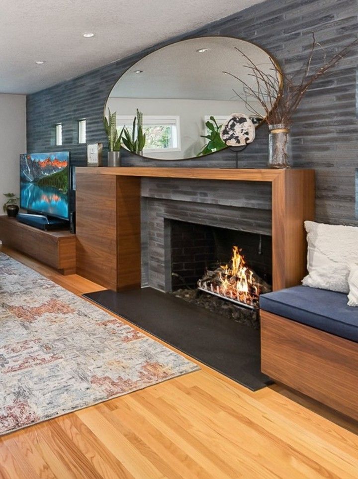 a living room filled with furniture and a fire place in front of a flat screen tv