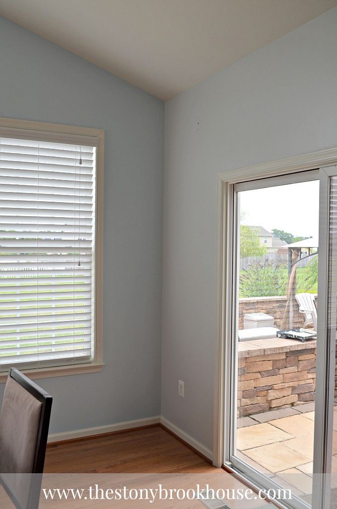 an empty room with sliding glass doors and hard wood flooring on the other side