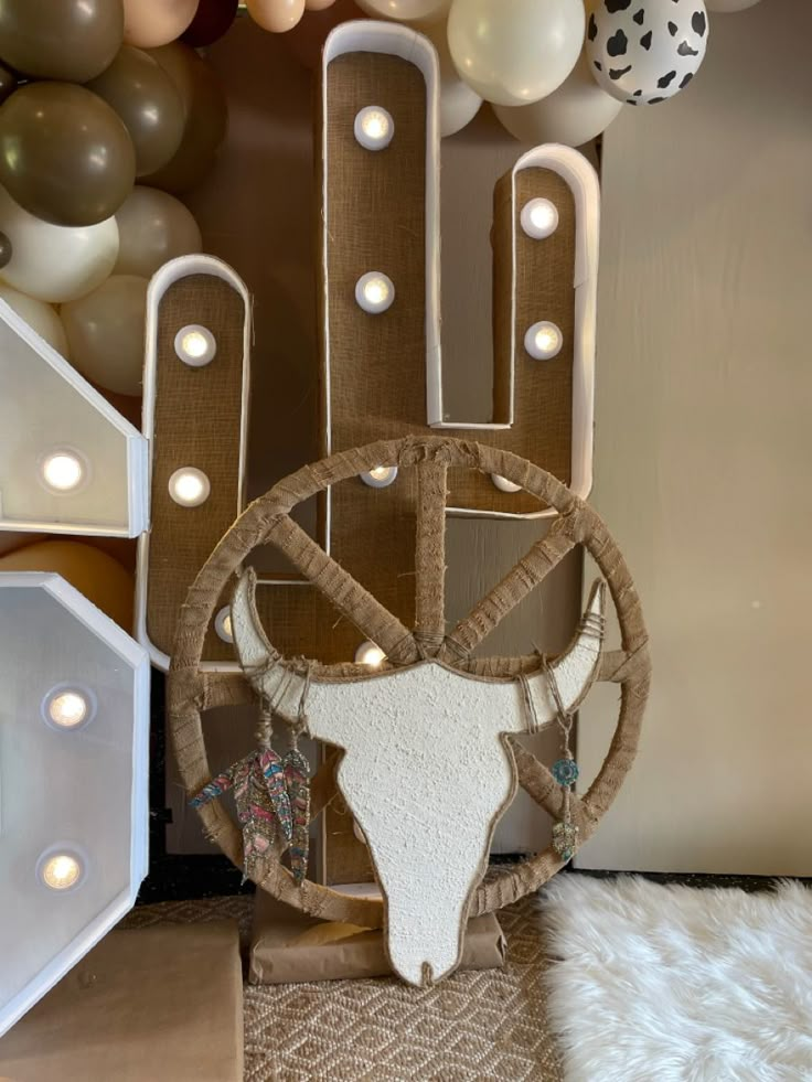 a cow skull on display in front of balloons