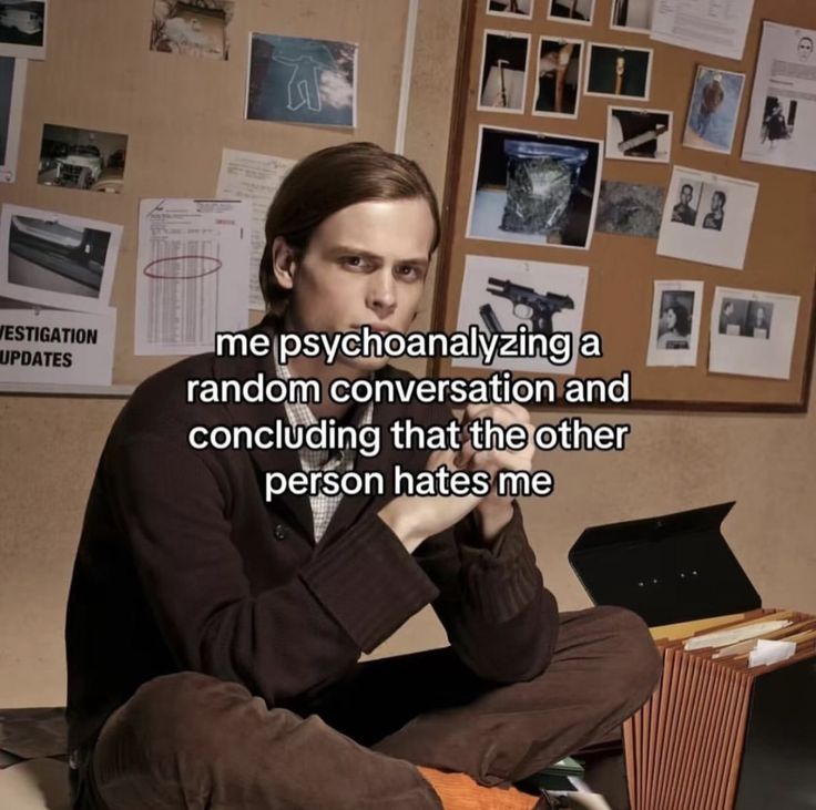 a man sitting in front of a laptop computer