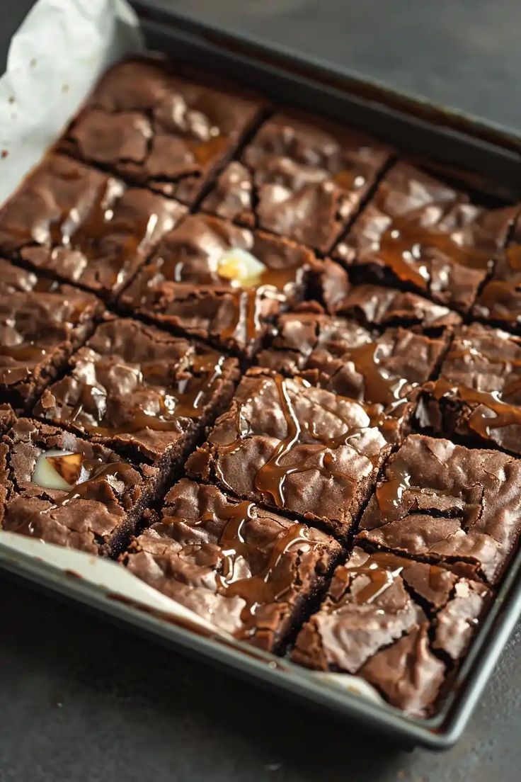 a pan filled with brownies covered in chocolate