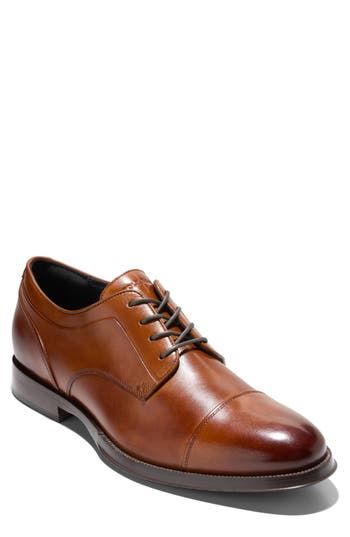 Smooth leather and a timeless silhouette come together on this sophisticated derby set atop a flexible sole enhanced with forefoot grooves. Lace-up style Removable, cushioned insole Leather and synthetic upper/textile lining/rubber sole Imported Fitted Dress Shoes With Removable Insole For Derby, Derby Cap Toe Dress Shoes With Removable Insole, Cap Toe Dress Shoes With Removable Insole For Derby, Fitted Dress Shoes With Cushioned Footbed For Work, Fitted Business Oxfords With Cushioned Footbed, Fitted Dress Shoes With Leather Footbed For Derby, Elegant Fitted Dress Shoes With Cushioned Footbed, Fitted Oxford Shoes With Cushioned Footbed And Plain Toe, Fitted Cushioned Oxfords With Plain Toe