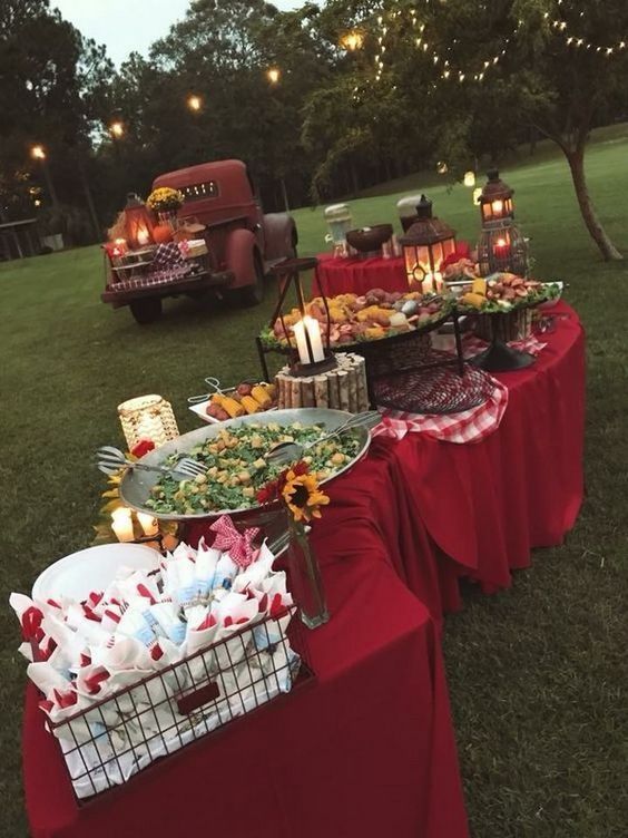 a table with food on it in the grass