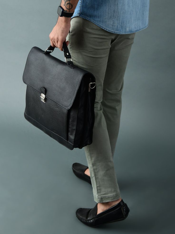 Our Sleek Black Attache Laptop Bag combines style with functionality. Crafted from robust buffalo leather, it exudes durability and sophistication. The metal clasp closure ensures secure storage, while the canvas lining adds sturdiness. There's a large main compartment along with other small compartments for keeping your belongings organized. With ample space, it comfortably accommodates a laptop, books, and files, making it perfect for office meetings or offsite outings. Elevate your profession Modern Bags With Hasp Closure, Timeless Flap Bag For Work, Classic Bags With Hasp Closure For Everyday Use, Versatile Satchel With Leather Lining For Work, Daily Use Coated Canvas Satchel Briefcase, Business Satchel With Leather Handles And Coated Canvas, Business Satchel With Leather Lining And Coated Canvas, Formal Satchel Shoulder Bag With Gunmetal Hardware, Versatile Business Shoulder Bag With Leather Handles