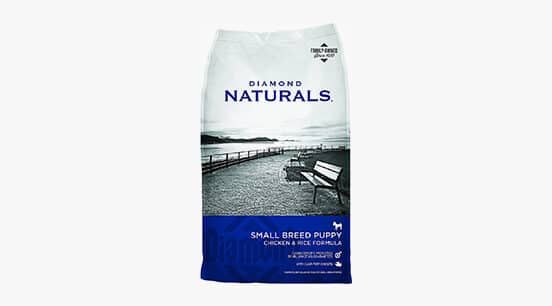 a bag of diamond naturals small breed puppy food sitting on top of a white table