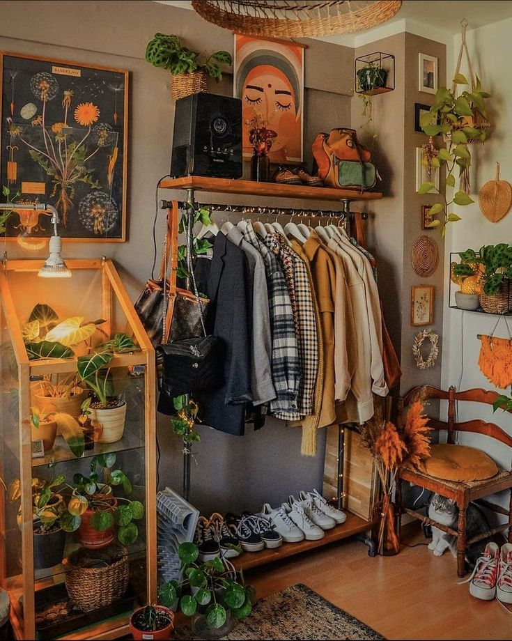 a room filled with lots of different types of clothes and plants on shelves next to each other