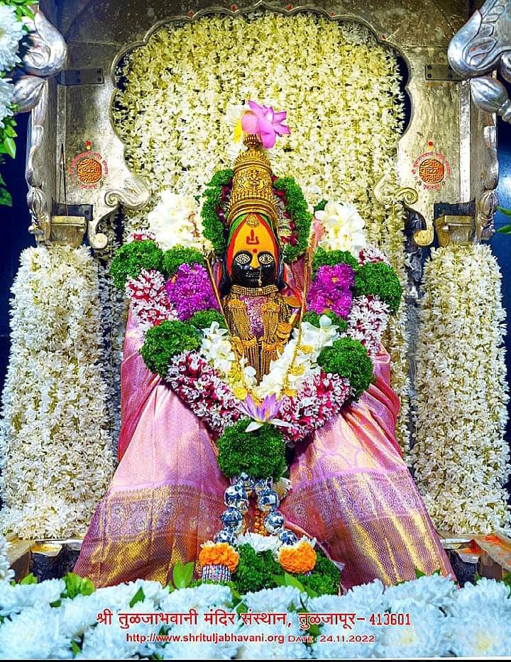 the idol is surrounded by flowers and garlands