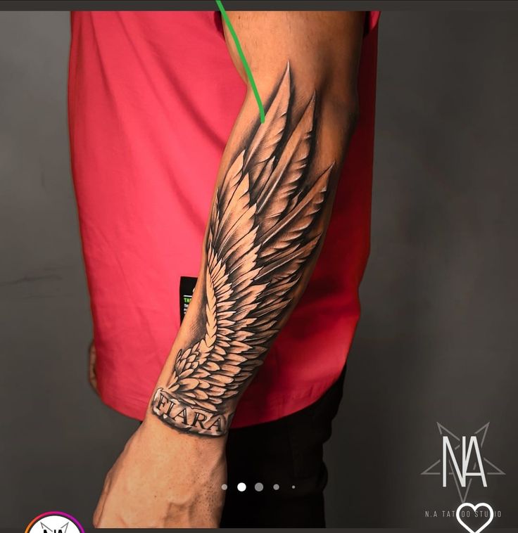 a man with a wing tattoo on his arm