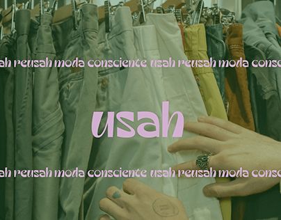 two hands touching each other in front of a rack of clothes with the words usan on it