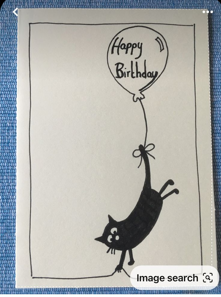 a birthday card with a cat holding a balloon