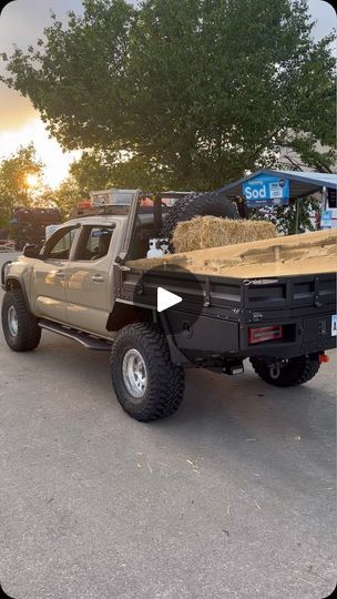 a pickup truck with hay in the bed