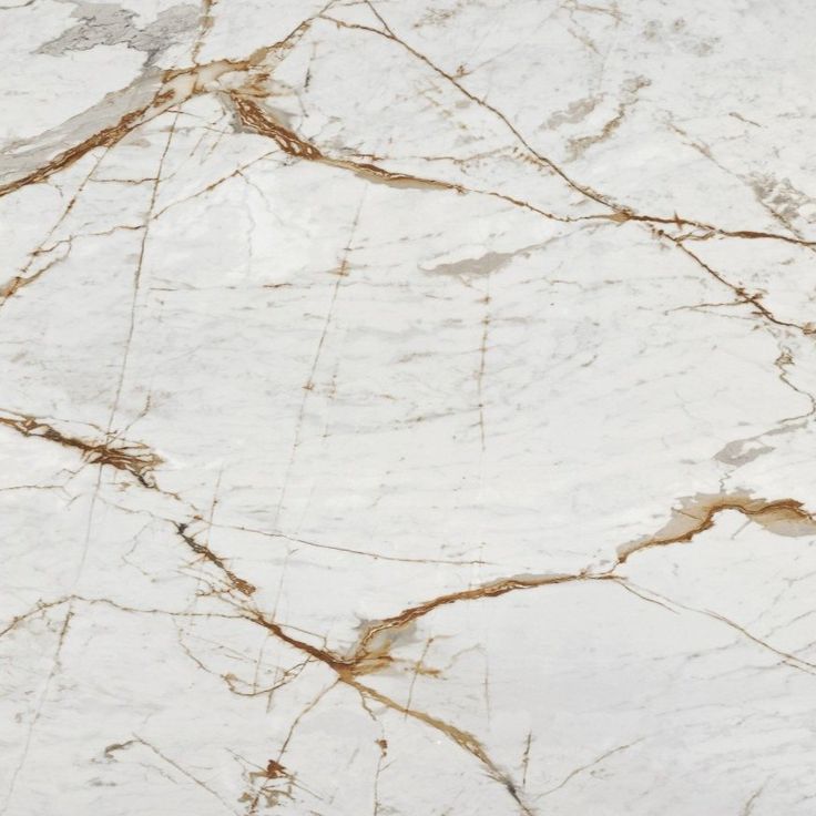 white marble with gold veining on it