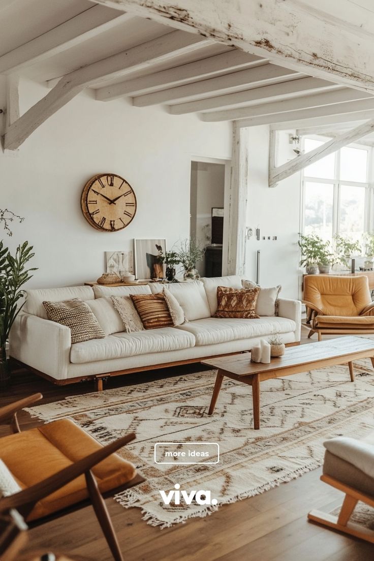 a living room filled with furniture and a large clock on the wall above it's windows