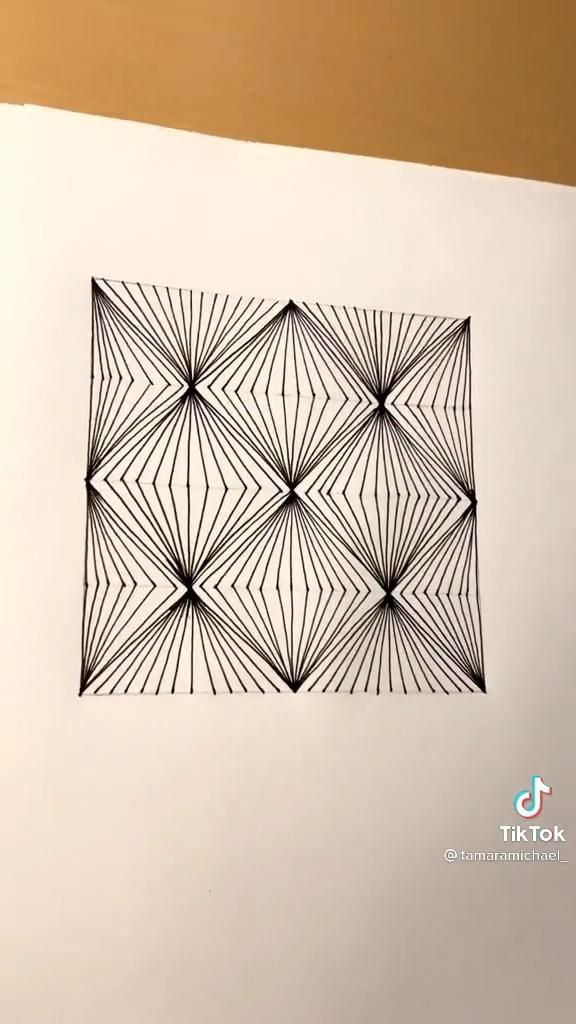 an abstract drawing on paper with lines and shapes in the middle, as well as a square