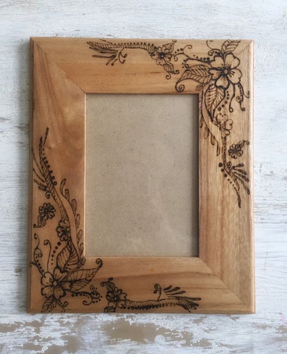 a wooden frame with an ornate design on it