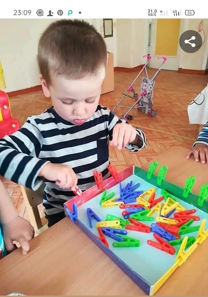 two young boys playing with plastic letters on a table