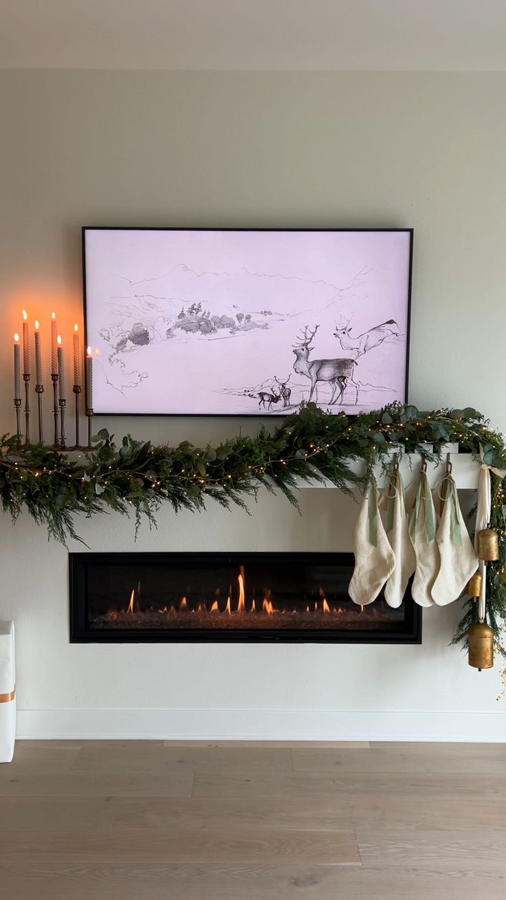 a fireplace with stockings hanging from it's mantle and lit candles on the wall