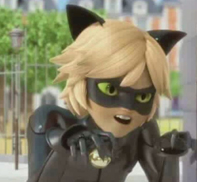 an animated character with green eyes and black cat ears, standing in front of a fence