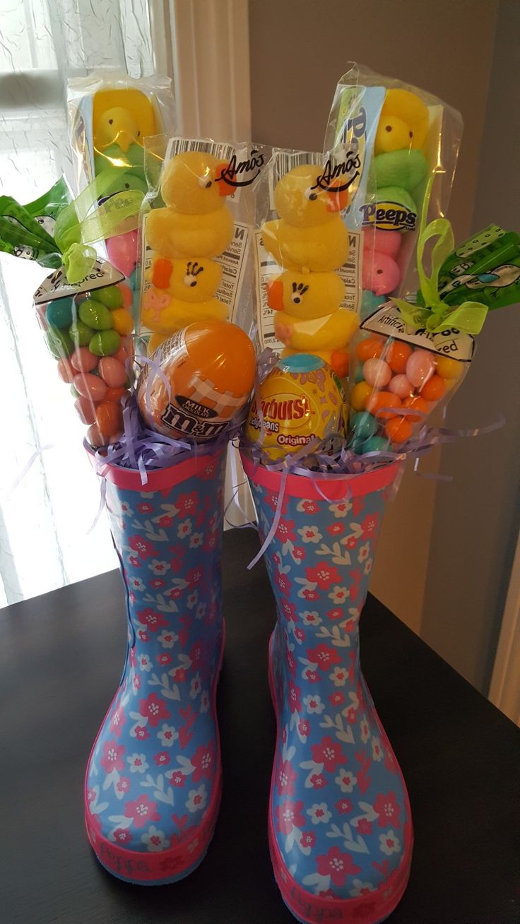 a pair of rubber boots filled with candy and candies