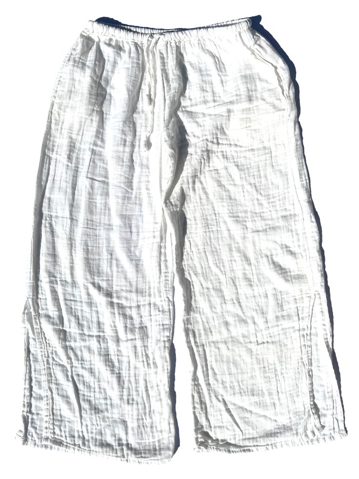 How many time do you reach for a cozy pair of pants? Yeah, us too! That's why we created the pier pant. For power-lounging seaside or at home. You're just going to love these as a wardrobe staple. Drawstring waist with a tie, side seam pockets and a generous side split at the hem. one free size up to a 2X Waist stretches to 46" 100% organic double gauze Machine wash/dry no returns on clothing: note, we don't use chemicals to finish our fabrics so the will shrink approximately 15-20% Comfortable Straight Leg Harem Pants For Loungewear, White Linen Lounging Bottoms, Relaxed Cotton Beach Pants, Relaxed Cotton Pants For Beach, Relaxed Fit Harem Pants For Loungewear, Relaxed Fit Wide Leg Harem Pants For Lounging, Comfortable White Beach Bottoms, Linen Lounging Pants, Comfortable White Beach Pants