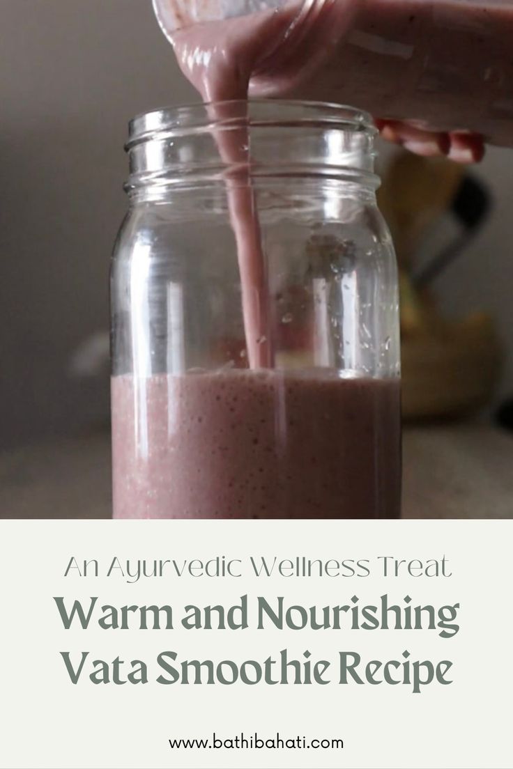 a person pouring pink smoothie into a jar with the words warm and nourishing vita - smoothie recipe