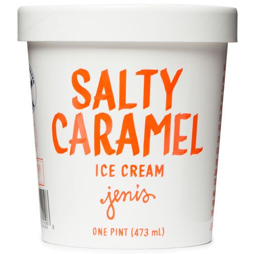 salty caramel ice cream is in a white cup with orange writing on the side