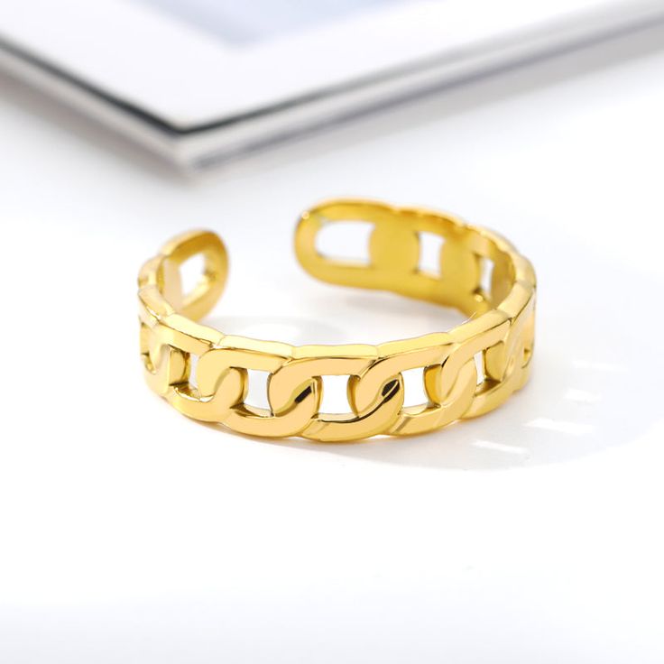 Adjustable Cuban link ring that pairs perfectly with other jewelry pieces or by itself. Your new favorite addition to your every day ring stack! Makes for a perfect gift for your loved ones or for yourself. Made of stainless steel and 18K gold-plated or silver plated - Tarnish resistant - Rust Free - Waterproof & Sweat-proof - Will not discolor - Hypoallergenic Material: Stainless Steel Color: 18K Gold Plated, Silver Plated Trendy Gold Stainless Steel Rings, Gold Stainless Steel Stackable Promise Rings, Trendy Hypoallergenic Metal Ring, Gold Rings With Adjustable Chain As Gift, Metal Promise Ring With Adjustable Chain, Gold Stainless Steel Stackable Rings For Gift, Minimalist Stainless Steel Chain Ring As Gift, Trendy Tarnish Resistant Stainless Steel Rings, Trendy Stainless Steel Tarnish Resistant Rings