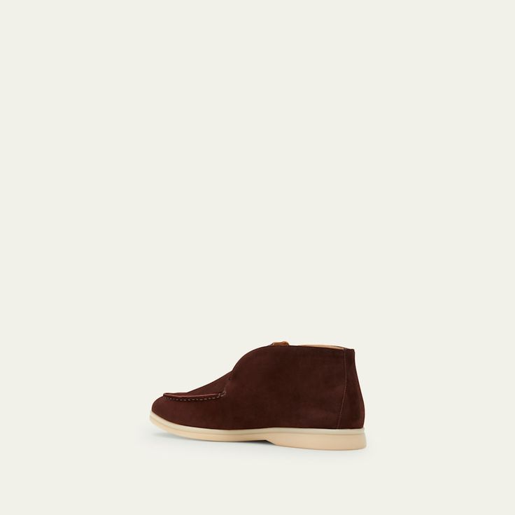 Loro Piana chukka boot/sneaker in suede. Almond toe. Notched vamp. Calfskin lining. Rubber outsole. Made in Italy. Slip-on Suede Chukka Boots With Leather Sole, Suede Slip-on Chukka Boots With Leather Sole, High-top Desert Boots With Suede Lining, High-top Suede Chukka Boots With Textured Sole, Suede High-top Chukka Boots With Textured Sole, High-top Suede Chukka Boots With Vibram Sole, Suede High-top Chukka Boots With Vibram Sole, Suede Chukka Boots With Rubber Sole, Suede Chukka Boots With Stitched Sole