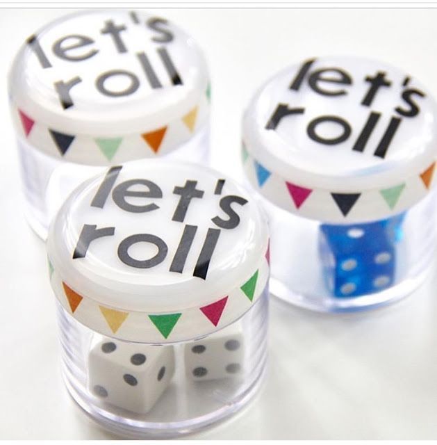 three dices with let's roll on them sitting in front of each other