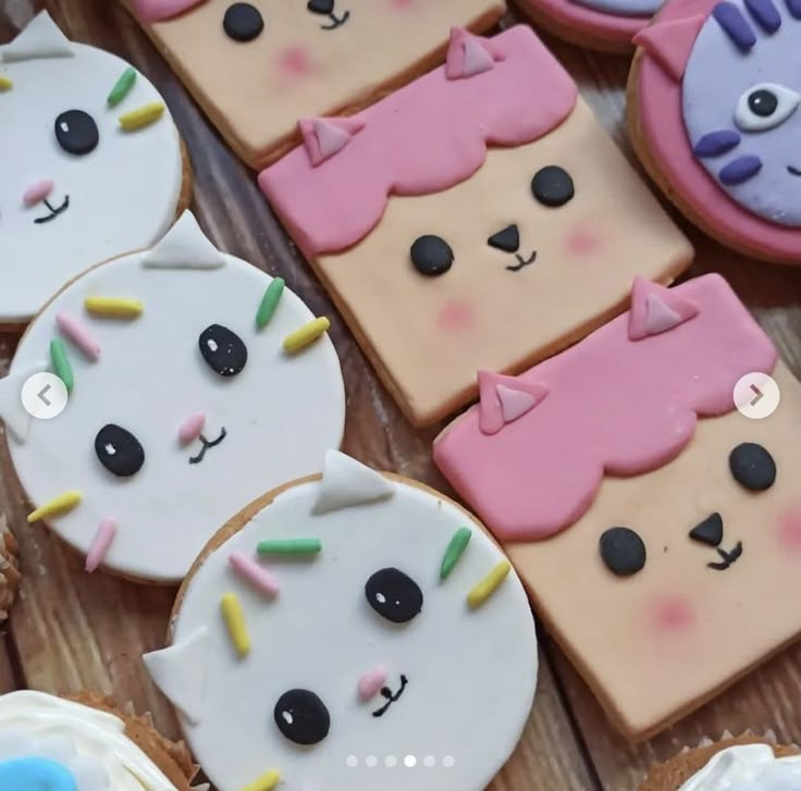 some decorated cookies are laying on a table