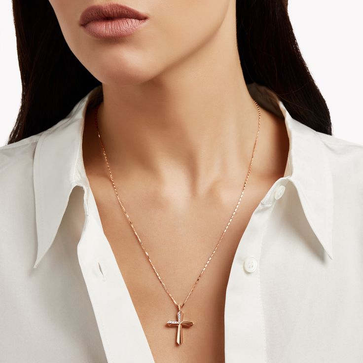 With its shining simplicity and defined silhouette, our Cross Pendant is a sleek and contemporary interpretation of a classic motif, realised in warm rose gold. Accented with pavé diamonds, the surface of the gold has been expertly faceted for a gleaming, polished finish. The Classic Graff collection celebrates the timeless jewels and eternally elegant designs that are quintessential Graff. Elegant Cross pendant in 18 carat rose gold with a total diamond carat weight of approximately 0.09 carats. Refined Sterling Silver Jewelry In Rose Gold, Refined Rose Gold Sterling Silver Jewelry, Rose Gold Pave Setting Necklaces, Modern Rose Gold Diamond Necklace With Accents, Rose Gold Pave Setting Necklace, Refined Rose Gold Jewelry With Diamond Accents, Refined Rose Gold Jewelry With Polished Finish, Refined Rose Gold Diamond Jewelry, Elegant Everyday Rose Gold Diamond Necklace