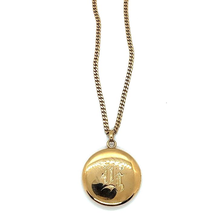 "Vintage 1930s 14k Yellow Gold Large Round Locket Pendant Necklace. The round locket measures 1.25\" in diameter and has an Old English \"G\" engraved on the backside and and a shiny finish on the front side. Inside is an old picture of a man and both sides have covers in gold frames which are removable. The left side is stamped 14k with exposed engine turning. The vintage locket is hanging on a 14k yellow gold curb link chain which is 2.8mm wide, and 28\" long and endless (no clasp). The weight of the locket with the necklace is 28.8g." Picture Of A Man, Vintage Locket, Round Locket, Gold Frames, Locket Pendant Necklace, Vintage Lockets, Plain Bands, Link Chain, Gold Frame