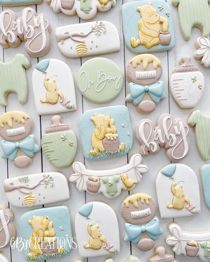 baby shower cookies are arranged on a table