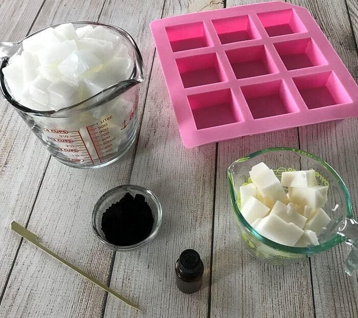 the ingredients to make an ice cube cake are laid out on a wooden table next to a measuring cup