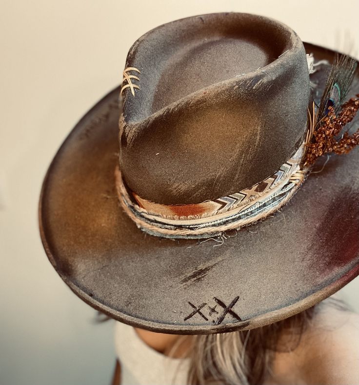 Our Custom Cowboy collection is where western meets your unique style - allow us to design a custom hat just for you! Featuring luxury 100% wool hats with stiff brims, simply choose your perfect base colour and personalized accents. Premium packaging is available for shipping to ensure your custom piece remains intact during transport. CURRENT STOCK INFO: Earthy Brown - 100% wool felt, stiffened wide flat brim to retain shape, and diamond shaped crown. Adjustable internal hat band up to 2cm for a tighter fit. Available in 57cm (M) sizing. Ivory White - 100% wool felt, stiffened wide flat brim to retain shape, and teardrop shaped crown. Adjustable internal hat band up to 2cm for a tighter fit. Available in 57cm (M) sizing.  **PLEASE NOTE:  *All Custom Cowboy hats are final sale as they are Mens Straw Cowboy Hat, Personalized Cowboy Hat, Cowboy Hat Burning, Custom Cowboy Hats Women, Custom Cowgirl Hats, Diy Leather Hat, Western Hat Styles, Western Hats For Women, Cowboy Hat Design