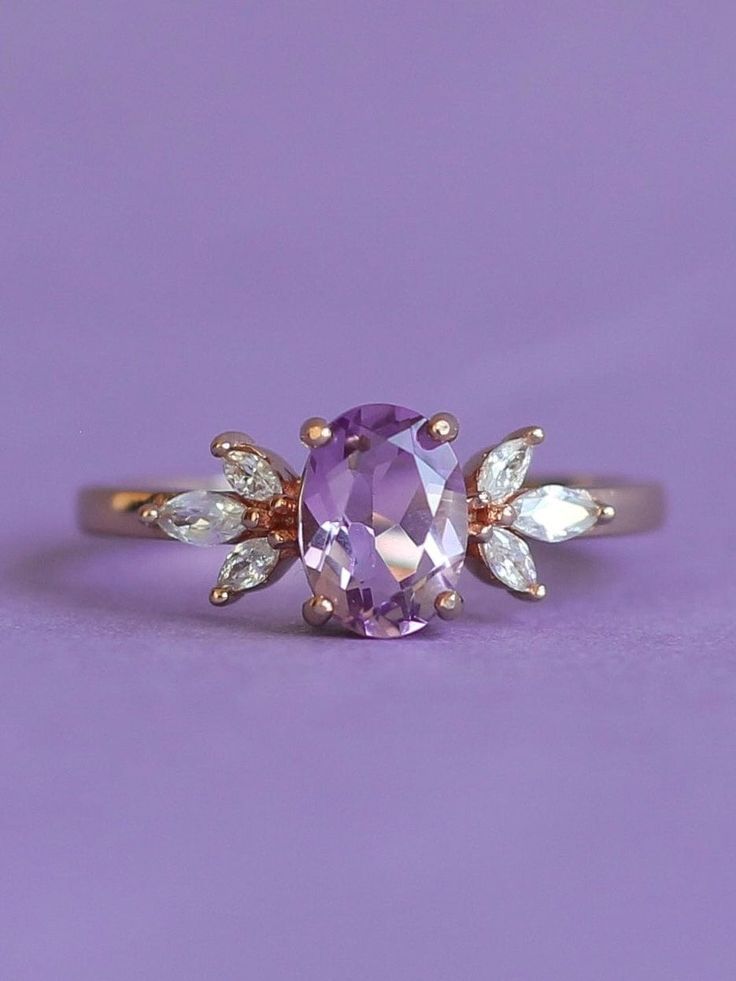 The immaculate vibes of our Contessa Ring are absolutely unmatched. ✨ The pristine and opulent amethyst crystal is framed by two delicate cubic zirconia blossoms in this delicate design. Delicate and regal, unique yet versatile, the Contessa Ring is a unique and stunning addition to any jewelry collection. 💜 Complete the look with our Tiara Stacker, Arc Stacker or Sweetheart Stacker! * * * Don't know your ring size? View our Ring Size Guide * * * …………………………………. RING SIZE & MATERIAL❋ 18k rose go Immaculate Vibes, Velvet Ring Box, Delicate Design, Ring Size Guide, Amethyst Crystal, Ring Box, Jewelry Pouch, Gold Plated Sterling Silver, 18k Rose Gold