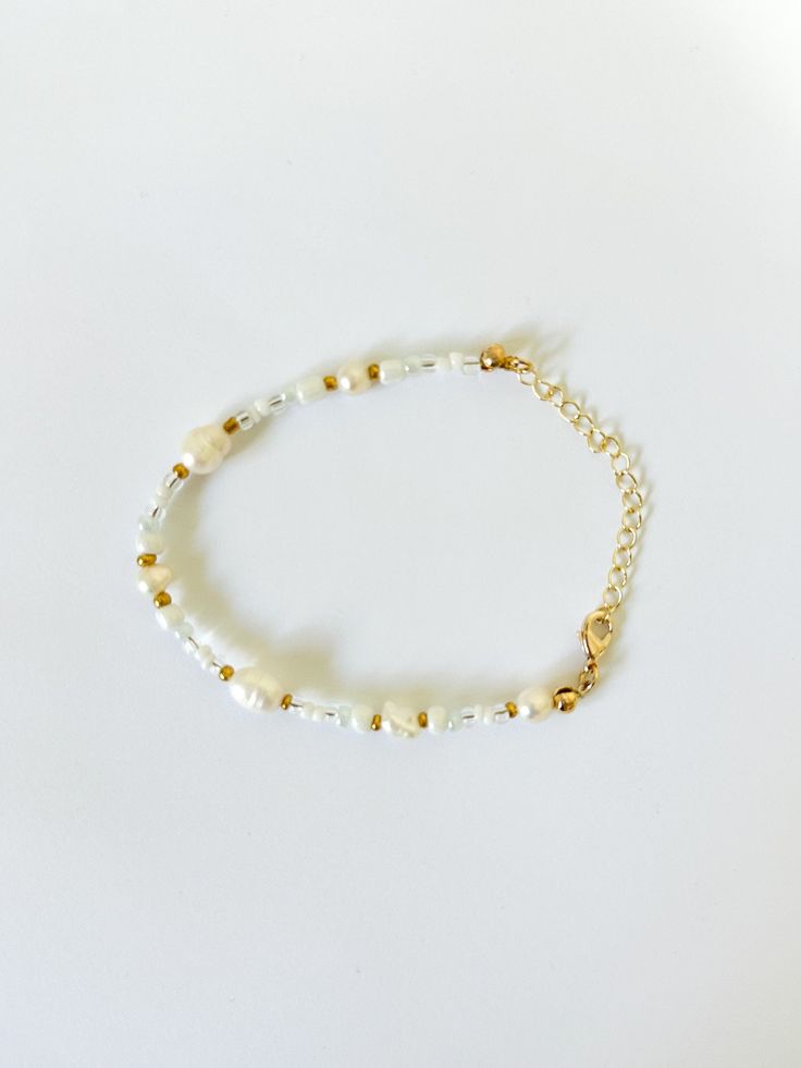 Beaded Bracelet   Hand beaded - real fresh water pearls and seed beads Tarnish Resistant   Delicate - handle with care Adjustable in size! Pearl Beaded Bracelets With Pearl Charm For Beach, Beach Beaded Bracelets With Pearl Charm, Pearl Bracelet With Tiny Beads As Gift, Dainty Pearl Beaded Bracelets With Round Beads, Beach Pearl Bracelet With Pearl Charm, Gift Pearl Bracelet With Tiny Beads, Pearl Beaded Bracelets With Round Beads, Pearl Chain Beaded Bracelets, Pearl White Beaded Bracelets With Pearl Charm