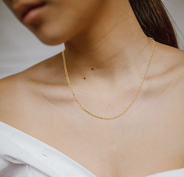 Curious what our favorite chain is? It's paperclip. We reccomend it if you're looking for a dainty layering piece - there's not many necklaces that don't go well with this paperclip chain. https://alexisjae.com/products/gold-paperclip-chain-necklace #chain #paperclipchain #goldnecklace #layernecklace #bestchain #chains #paperclipnecklace #trendynecklace Paperclip Chain Necklace, Paperclip Necklace, Solid Gold Chains, Small Charms, Gold Paper, Trendy Necklaces, Gold Chain Necklace, Pure Gold, Paper Clip