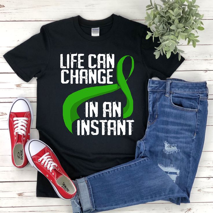 "* All shirts are unisex. * Product measurements may vary by up to 2 inches. * All Designs are originally made by myself or my team.  Brain Injury Awareness shirt with the quote \"Life Can Change In An Instant\" is a fun gift for men and women!  To see more designs of your topic Brain Injury Awareness you can search & find them in my store:   https://www.etsy.com/shop/Retailorie  You find there also an announcement if the shipping & production times change :) brain injury shirt,brain injury tshirt,tbi awareness,green ribbon,head injury shirt,tbi shirt,tbi gift,brain surgery shirt,trauma brain,brain surgery gift," Casual Cotton Shirt For Awareness Events, Brain Surgery Tattoo Ideas, Black Short Sleeve Tops For Awareness Events, Cotton Tops With Letter Print For Awareness Events, Casual Crew Neck Shirt For Awareness Events, Pre-shrunk Graphic Tee For Awareness Events, Casual Pre-shrunk T-shirt For Awareness Events, Brain Injuries Tattoo, Traumatic Brain Injuries Tattoo