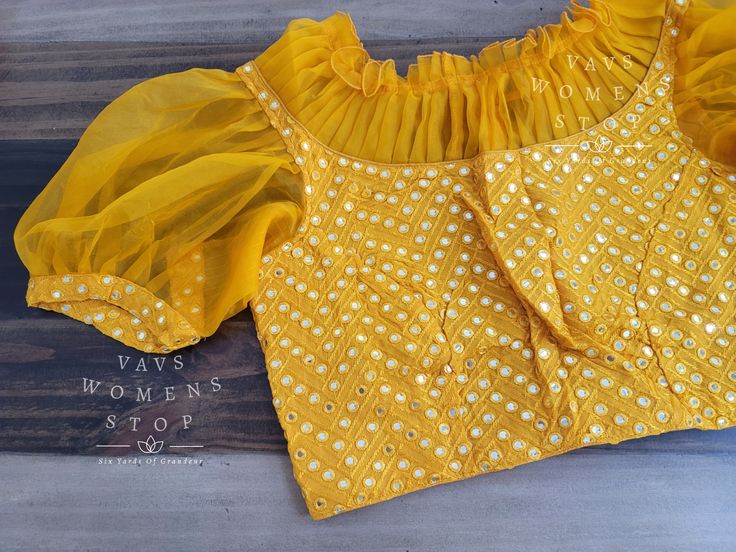 Blouse stitched - Yes Blouse Opening - Back Sleeves Length - Elbow Padded - No Blouse size - 38 with inner margins expandable upto 44 For Blouse Size 36 alteration can be done on request. Designer Tops With Gota Work For Diwali, Festive Fitted Blouse With Mirror Work, Fitted Festive Blouse With Mirror Work, Designer Yellow Blouse With Gota Work, Yellow Blouse With Gota Work For Navratri, Navratri Yellow Blouse With Gota Work, Yellow Blouse With Gota Work For Festivals, Festive Yellow Blouse With Gota Work, Yellow Gota Work Bollywood Blouse