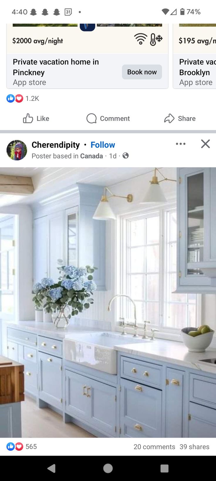 an image of a kitchen with blue cabinets and white counter tops on the left side