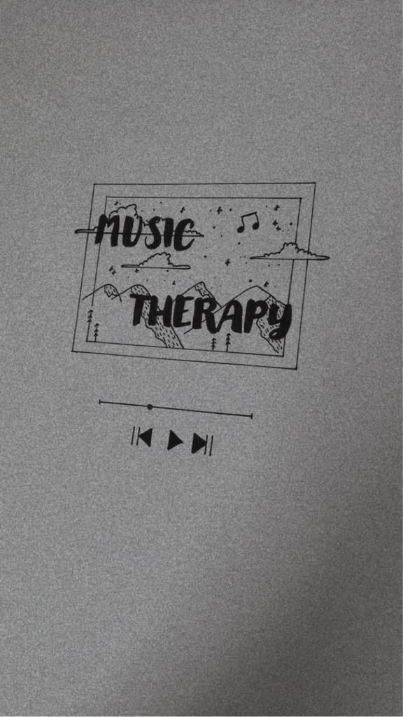 the words music therapy written in black ink