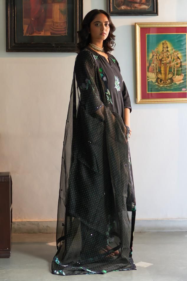 Black hand woven cotton anarkali with floral sequins, applique embroidery. Paired with pant and printed dupatta.
Components: 3
Pattern: Embroidered
Type Of Work: Floral
Neckline: Notched
Sleeve Type: Three quarter
Fabric: Mangalgiri cotton 
Color: Black
Other Details: 
Embroidery detailing on dupatta
Length:
Anarkali: 46 inches
Pant: 38 inches
Approx. product weight: 1-3 kg
Model height: 5ft 7inches, wearing size M
Occasion: Sangeet - Aza Fashions Cotton Sharara With Sheer Dupatta For Festivals, Black Semi-stitched Palazzo Set With Mirror Work, Festive Cotton Palazzo Set With Sheer Dupatta, Cotton Sharara With Sheer Dupatta For Eid, Designer Cotton Palazzo Set With Sheer Dupatta, Floor-length Cotton Kurta With Resham Embroidery, Floor-length Cotton Traditional Wear With Dupatta, Festive Floor-length Cotton Dupatta, Cotton Salwar Kameez With Sheer Dupatta For Navratri