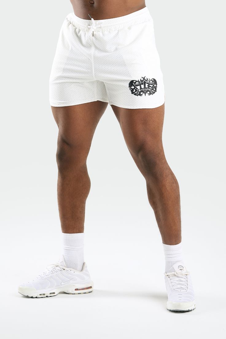 Train insane in the gym in these one-of-a-kind 5 inch mesh shorts with our iconic Train Like A Freak skull shorts that started a revolution over a decade ago. Engineered with our lightweight, breathable, and ultra-soft 4-way stretch Mesh Tech DNA® fabric. These white or black mesh gym shorts will keep you geared up in Gym-To-Street style for wherever life takes you. The Train Like A Freak Lineage Collection is back, bigger, stronger, and harder than ever! Functional Mesh Shorts With Built-in Shorts, Breathable Shorts For Summer Jogging, Breathable Summer Jogging Shorts, Breathable Summer Shorts For Jogging, Summer Athletic Shorts Squat Proof For Training, Squat Proof Athletic Shorts For Summer Training, Summer Squat Proof Athletic Shorts For Training, White Athletic Shorts With Built-in Shorts For Gym, Breathable Mesh Bottoms For Gym