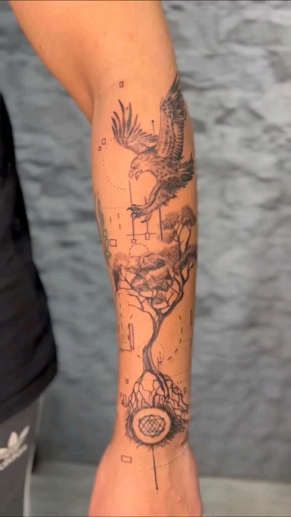 a person with a bird tattoo on their arm