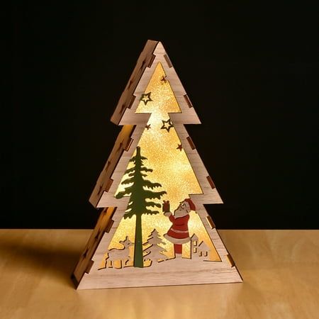 a small wooden christmas tree with lights on it's sides and santa in the middle