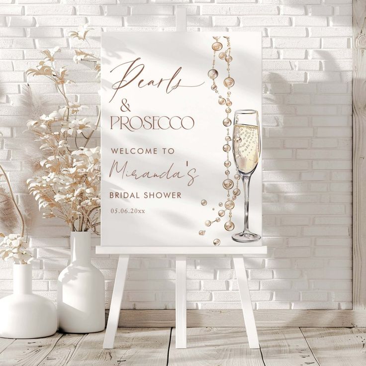 a welcome sign and vases with flowers in front of a white brick wall that says don't & proscicoo