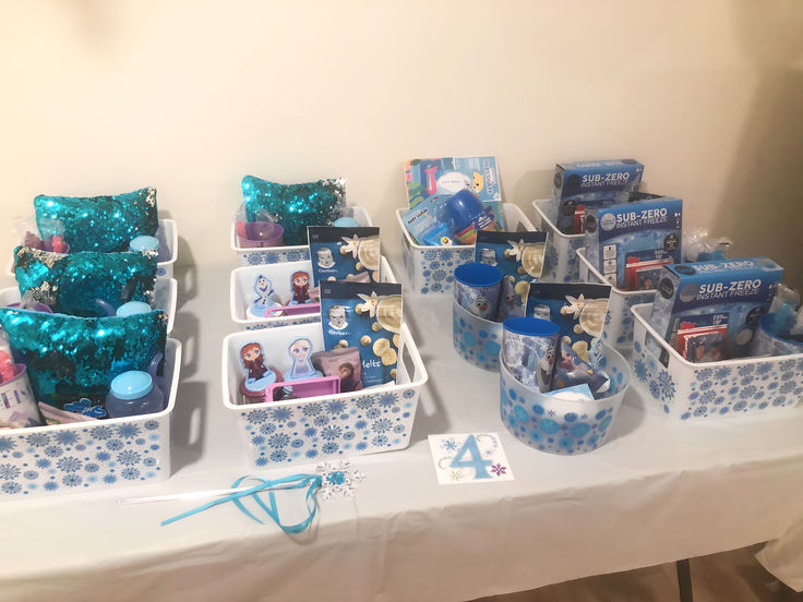 the table is set up with several baskets and items for baby's first birthday