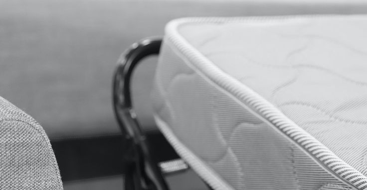 a close up view of a mattress on a chair