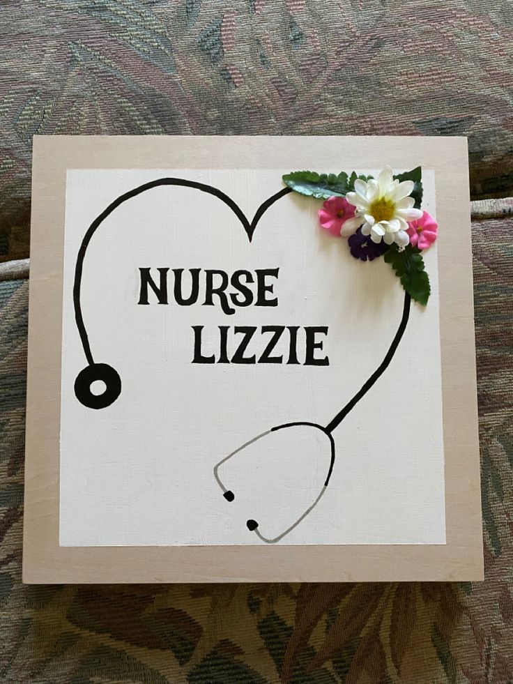 a nurse's stethoscope is attached to a sign that says nurse lizzie